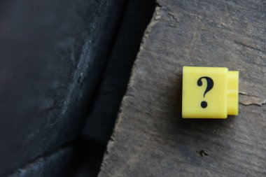 Large question mark on a blue background..