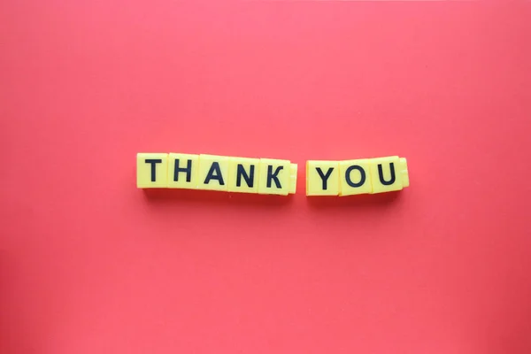 Thank You Concept Inscription Yellow Letters Red Background 图库图片