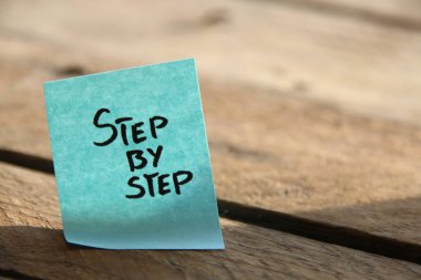 Step by step concept. Motivational quotes. The inscription on the blue tag.