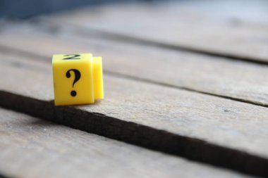 Question mark on a yellow cube. Place for text. Vintage style.