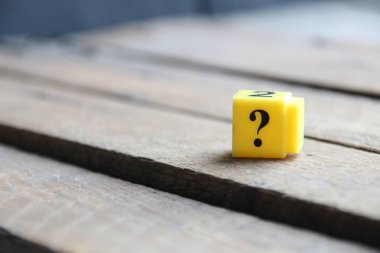 Question mark on a yellow cube. Place for text. Vintage style.