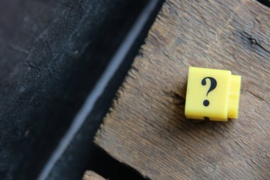 Large question mark on a blue background..