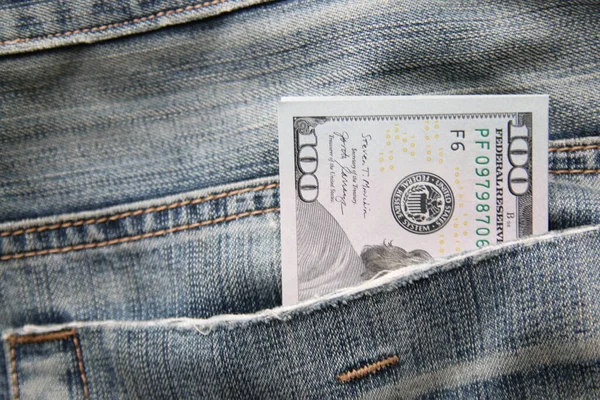 Dollars in a jeans pocket, Closeup. Money in pocket.