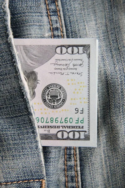 Dollars in a jeans pocket, Closeup. Money in pocket.