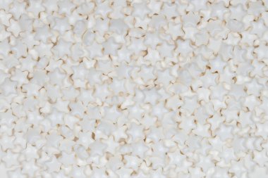 Beyaz Şeker Yıldızlarının Şablon Arkaplanı - Düğün İçin Zarif Dekoratif Serpintiler ve Noel Tatil Pişirme - Yakın Çekim Şekerlemesi Fotoğrafçılığı