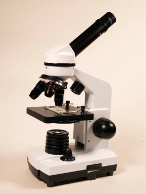 Microscope close-up. Examination of a micro sample on a glass slide. Animation for use in science and medicine.