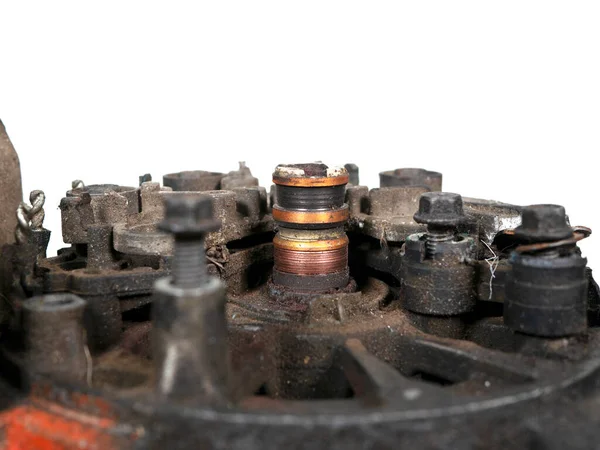 Heavily worn rings of a car generator isolated on a white background, close-up, selective focus.