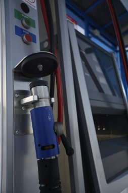 Detailed view of the gas fuel filler nozzle adapter of a compressed natural gas (CNG) filling station. Refueling vehicle with a renewable energy source with zero emissions.