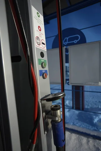 Detailed view of the gas fuel filler nozzle adapter of a compressed natural gas (CNG) filling station. Refueling vehicle with a renewable energy source with zero emissions.