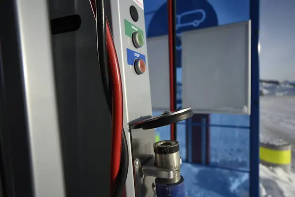 Detailed view of the gas fuel filler nozzle adapter of a compressed natural gas (CNG) filling station. Refueling vehicle with a renewable energy source with zero emissions.