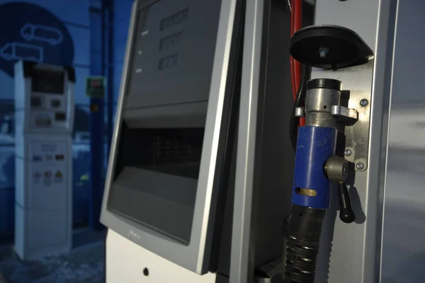 Detailed view of the gas fuel filler nozzle adapter of a compressed natural gas (CNG) filling station. Refueling vehicle with a renewable energy source with zero emissions.