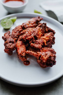 spicy chicken wings with buffalo sauce. Food with rustic background with copy space. Top view