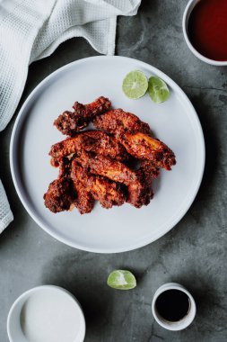 spicy chicken wings with buffalo sauce. Food with rustic background with copy space. Top view
