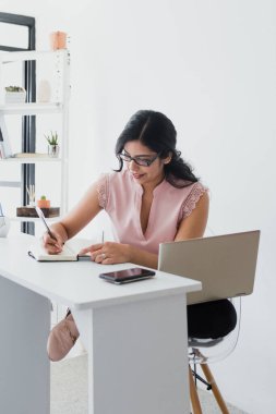 hispanic business woman working in her desk at office in Mexico Latin America