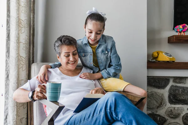 Hispanic Family Granddaughter Grandmother Reading Book Woman Senior Home Latin — Stock Photo, Image