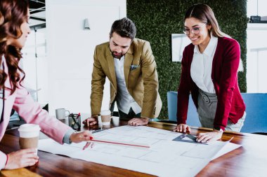Group of young hispanic people of architects or Designer teamwork planning and working on interior design project or architecture development in a creative office in Mexico Latin America