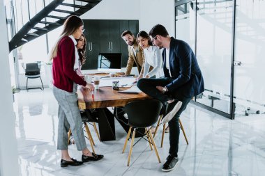 Group of young hispanic people of architects or Designer teamwork planning and working on interior design project or architecture development in a creative office in Mexico Latin America