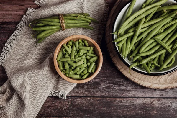 Bowl of Cut Raw Green Beans on wooden table in Mexico Latin America