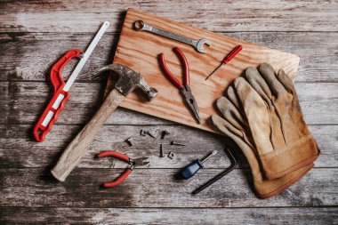 Set of tools on rustic and vintage table for handicraft or construction