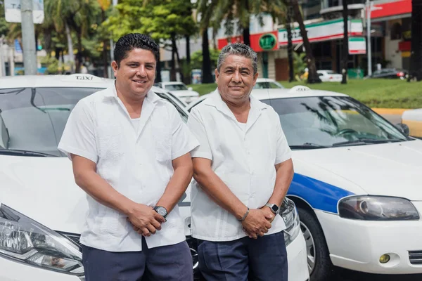 portrait of latin couple of taxi drivers men with car on background at city street in Mexico in Latin America, Hispanic people