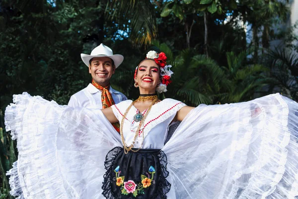 stock image Latin couple of dancers wearing traditional Mexican dress from Veracruz Mexico Latin America, young hispanic woman and man in independence day or cinco de mayo parade or cultural Festival