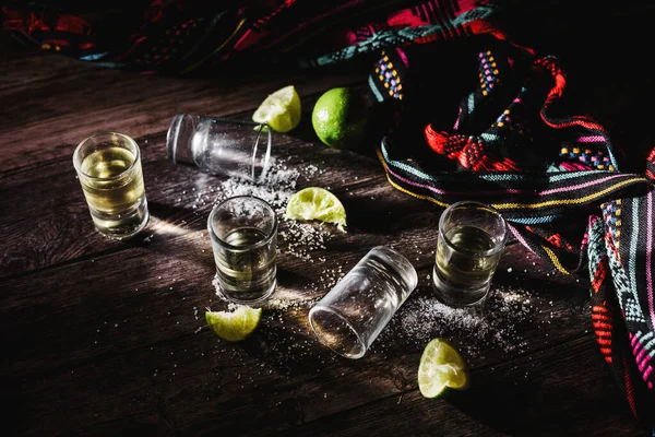 Tequila Shots with Lime and Salt for Mexican Party with Empty glasses on table in Mexico After Party, drinks and beverage