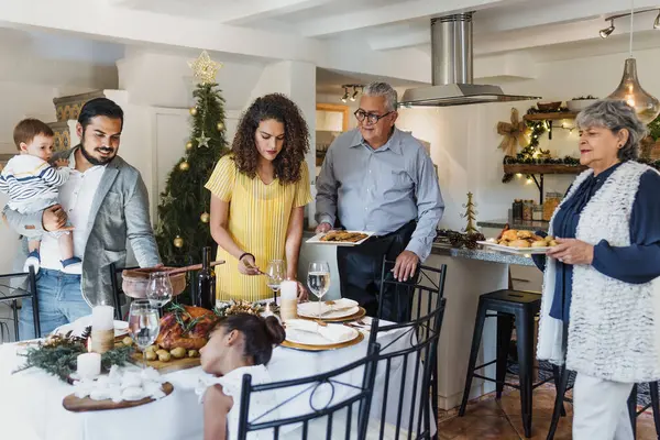 Latin family having Christmas dinner at home in Mexico Latin America, hispanic people eating at holidays