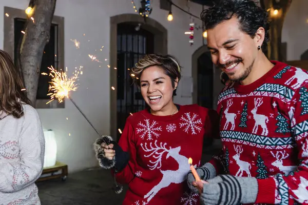 stock image Latin family celebrating Mexican Posadas and Singing carols in Christmas eve in Mexico Latin America, hispanic culture and traditions