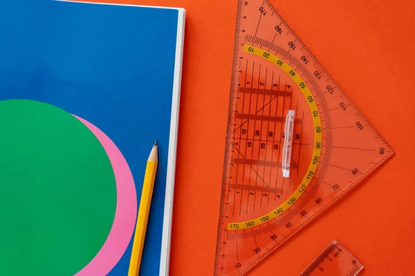 Ruler, compass, pencil at open notepad. Accessories for learning mathematics. Education, Back to school concept