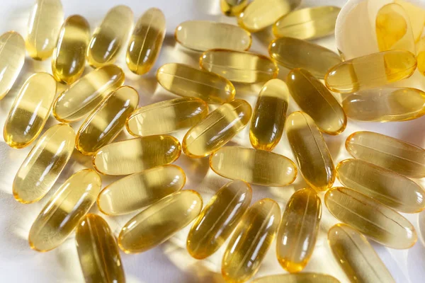 Close Yellow Capsules White Background Omega Oil Capsules Medical Vitamins — Stock Photo, Image