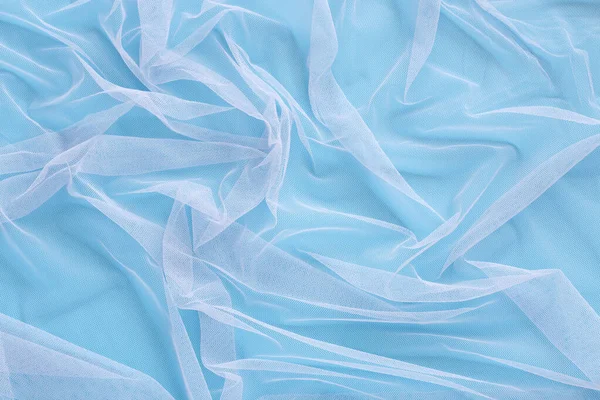 Falisty Wzór Jasnego Tiulu Tkaniny Miękkim Kolorowym Niebieskim Tle Streszczenie — Zdjęcie stockowe