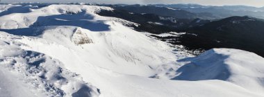 The rocky slope of the snow-covered mount Gandarm on Svydovets mountains, Carpathians