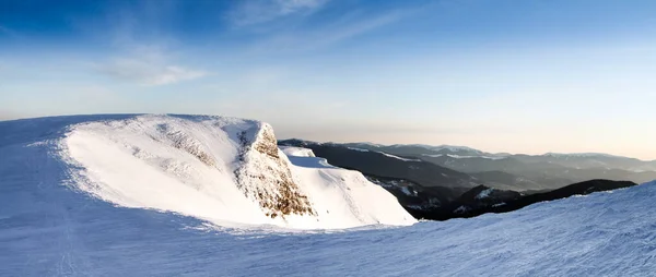 The rocky slope of the snow-covered mount Gandarm on Svydovets mountains, Carpathians