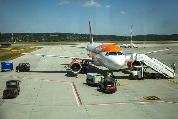 stock image Jun 11 2021: Milan, Italy - The airplane is parked on the runway of the airport, awaiting its passengers.