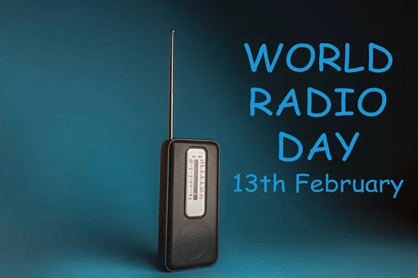 World Radio Day 13 February text with radio on blue background. Selective focus.