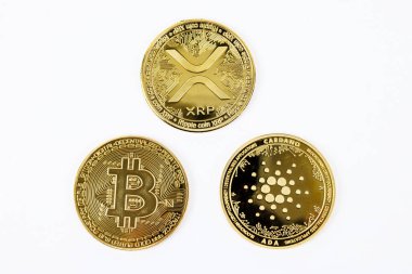 Golden cryptocurrency coins of Bitcoin, Cardano, and Ripple on a clean white background. clipart