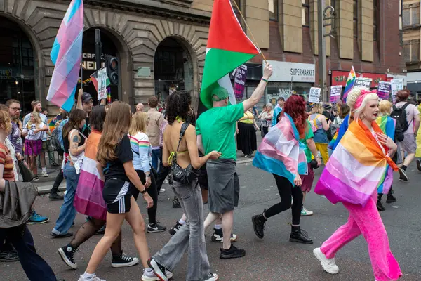 stock image Glasgow Pride July 20 2024. The streets of Glasgow UK been drenched in colour during as the annual Pride march gets underway.  From Festival Park to Glasgow Green. The city was a sea of rainbow flags  to support people who are LGBT+  