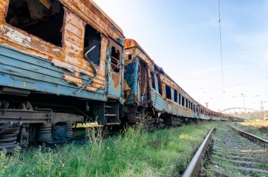 burned out blown up wagons war between Russia and Ukraine