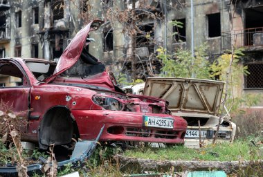 damaged and looted cars in a city in Ukraine during the war with Russia