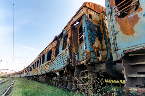 burned out blown up wagons war between Russia and Ukraine