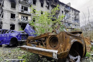 damaged and looted cars in a city in Ukraine during the war with Russia