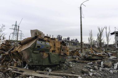 burnt tank and destroyed buildings of the Azovstal plant shop in Mariupol war in Ukraine with Russia