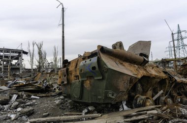 burnt tank and destroyed buildings of the Azovstal plant shop in Mariupol war in Ukraine with Russia