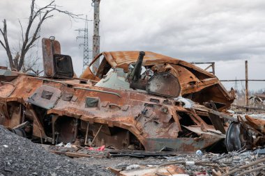 burnt tank and destroyed buildings of the Azovstal plant shop in Mariupol war in Ukraine with Russia