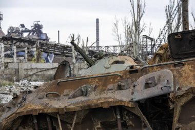 burnt tank and destroyed buildings of the Azovstal plant shop in Mariupol war in Ukraine with Russia