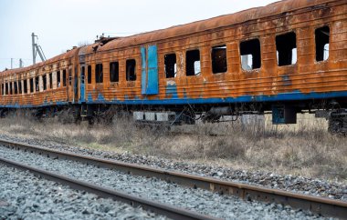 burned out blown up wagons war between Russia and Ukraine