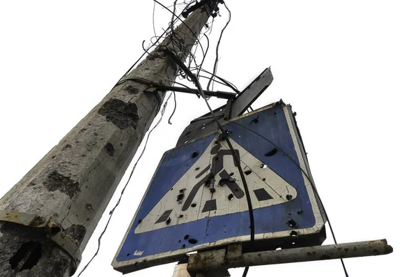 stock image concrete pillar broken by shards and blue road sign isolated