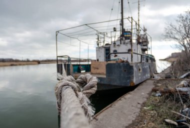abandoned old damaged ships in the port without people during the war between Ukraine and Russia