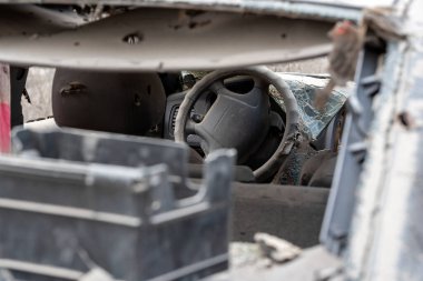 damaged and looted cars in a city in Ukraine during the war with Russia
