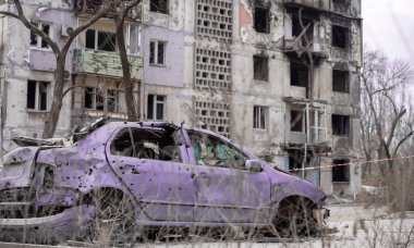 damaged and looted cars in a city in Ukraine during the war with Russia